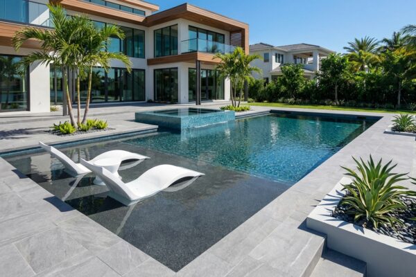 Modern luxury geometric pool with sun shelf in Florida